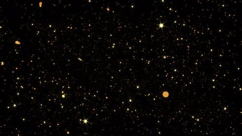 Sparkling Golden Glitter Particles and Shimmering Stars Background