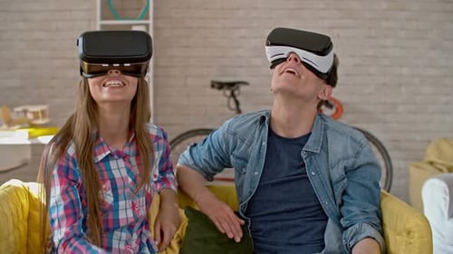 Teenagers Experiencing Virtual Reality Headsets in Bright Living Room