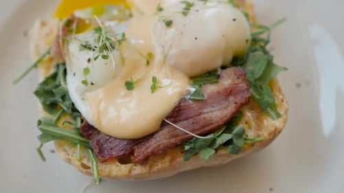 Eggs Benedict with Bread and Tomato on a Plate with Becon Morning Sandwich