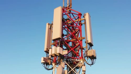 Telecommunications tower carrying broadcasting antennas for 3G, 4G and 5G cellular networks.