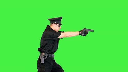 Caucasian Policeman in Uniform Runs Stops to Shoot and Runs Away on a Green Screen Chroma Key