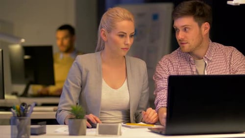 Business Team Making High Five at Night Office