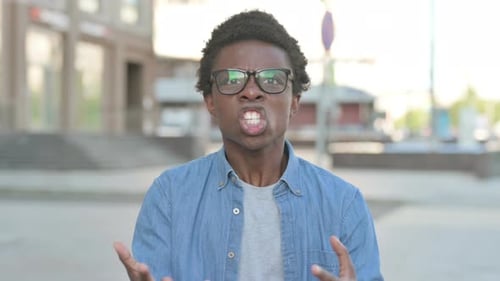 Angry Young African Man Fighting Outdoor
