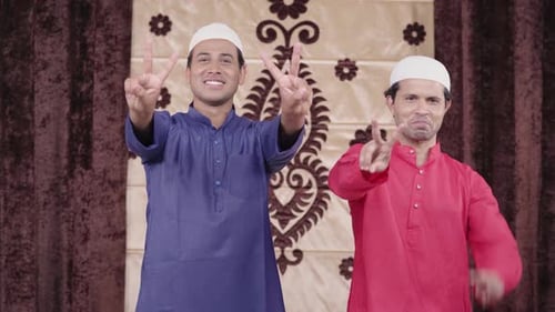 Men in Kurtas Posing with Two Finger Gesture