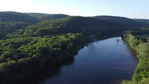 aerial view overlooking river and trees