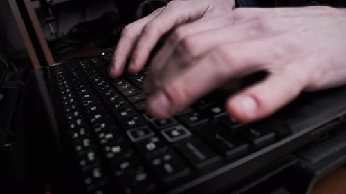Close Up of Hands Typing on Laptop Keyboard