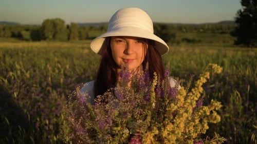 Portrait Woman with Bouquet of Field Flowers