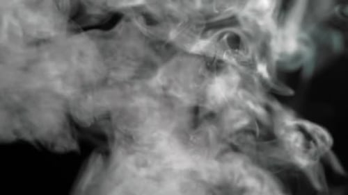 Billowing White Smoke on Black Background