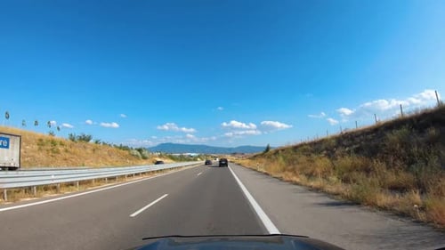 Road Trip on Europe Firstperson View of a Moving Car on a Highway Summer Mountains Natural Landscape