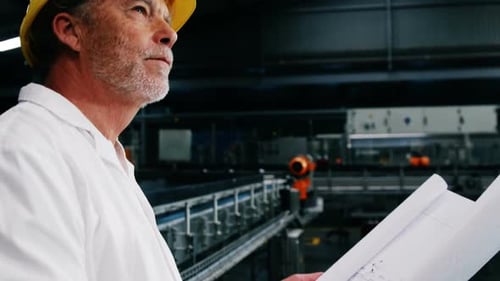 Engineer reading a blue print