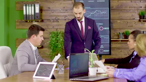 Team Discussing Financial Reports in Modern Workplace