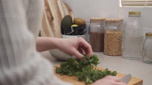 Person Preparing Healthy Salad in Home Kitchen