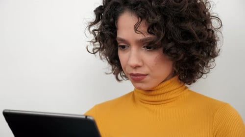 Close Up Woman Freelancer Uses Tablet Tapping and Scrolling Screen Display