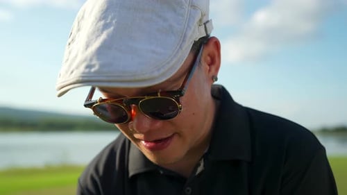 4K Asian man golfer golfing at country club at summer sunny day.