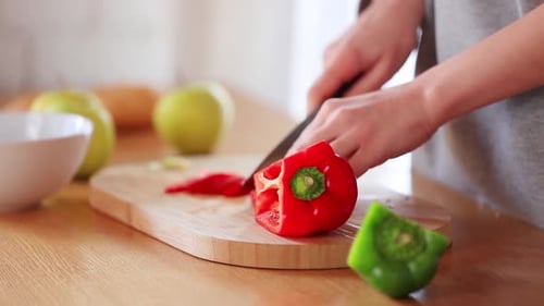 Slicing Red Bell Pepper on Cutting Board