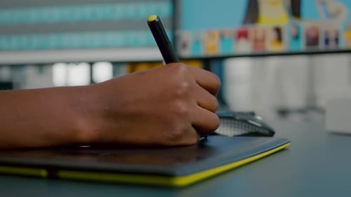 Close Up of Photo Designer Editing with Tablet and Pencil