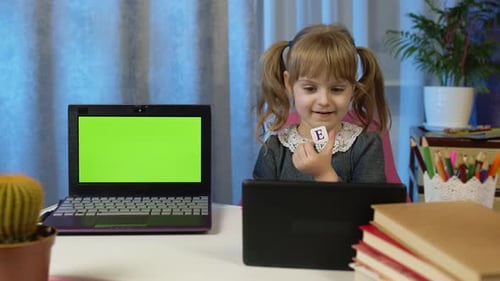 Child Girl Pupil Doing Homework with Teacher Using Digital Tablet at Home Laptop Green Screen
