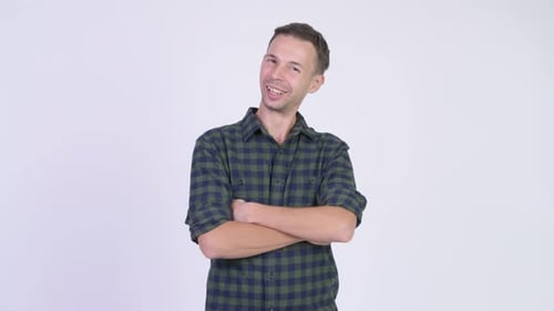Studio Shot of Happy Hipster Man with Arms Crossed