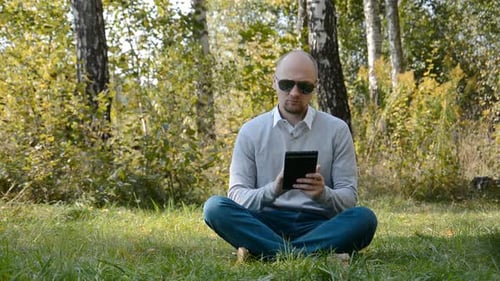 Businessman Using Tablet Outdoors