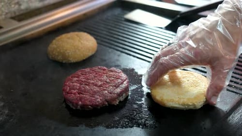 Tasty Burger and Buns Cooking on Hot Grill