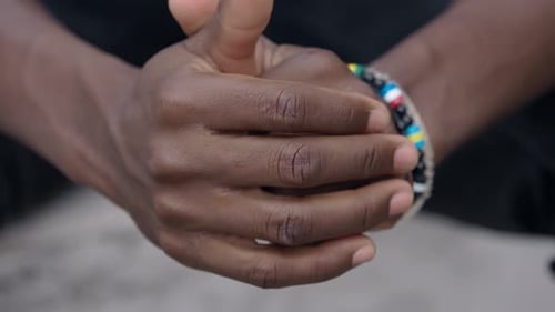 Detailed Close Up of Man's Hands with Bracelet