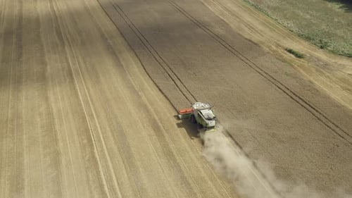 Combine Harvester in Field Aerial Shot