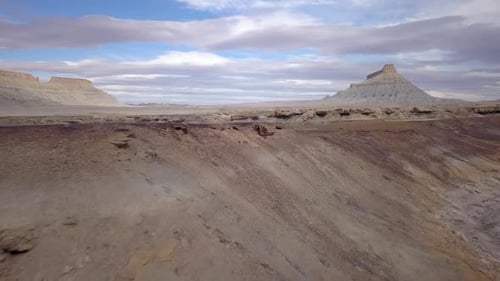 Flying through the Utah desert over colorful terrain