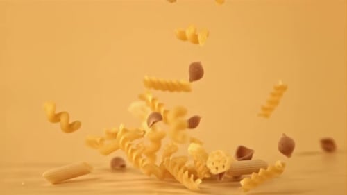 Dry Pasta Falling in Slow Motion