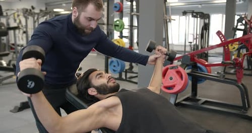 Pakistani Guy Training with Coach at Gym