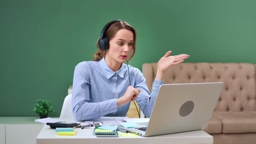 Woman Attending Online Meeting From Home