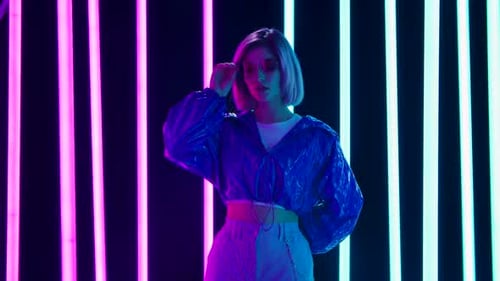 Stylish Woman Posing in Neon Lights