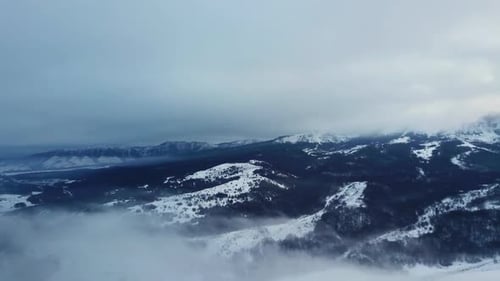 Epic Aerial Flight Near Mountain Clouds Towards Sunrise. Picturesque and Gorgeous Scene.