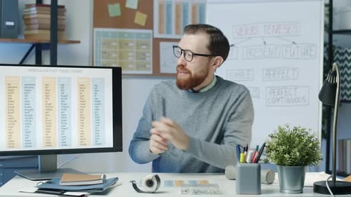 Male Teacher Explaining Grammar Tenses Online