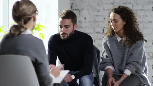 Couple in Therapy Session Holding Hands