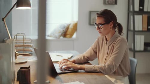 Professional Business Lady Working on Laptop in Office