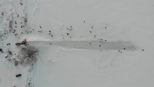 Aerial View of People Ice Skating on Winter Day