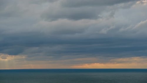 Beautiful cloudscape over the sea, sunset time lapse shot