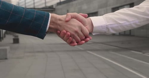 Close Up of a Handshake Between Two People