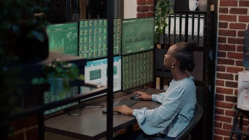 African American Woman Analyzing Stock Market Investment