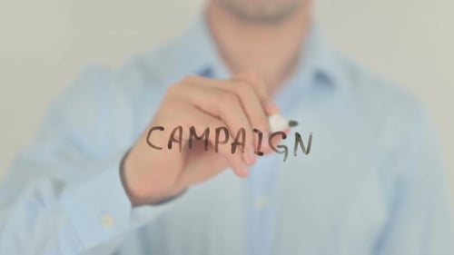 Campaign, Man Writing on Transparent Screen