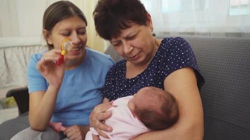 Loving Family Admires Newborn Baby at Home