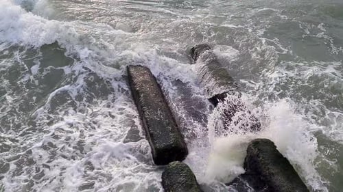 Waves Crashing on Rocks in Ocean Aerial View