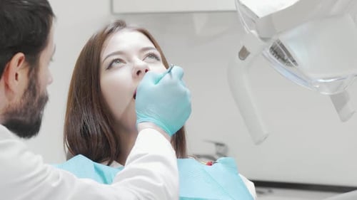 Woman Having Dental Checkup at the Dentist Office