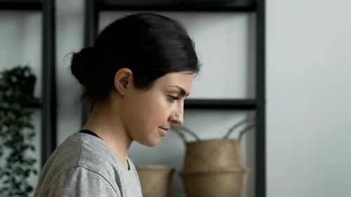 Close-Up Portrait of A Young Indian Woman Working on a Laptop, Doing Online Training or Business