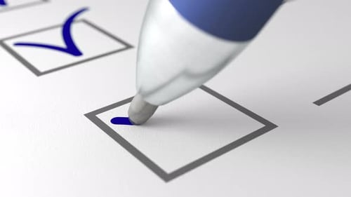 Blue Ball Pen Writing a Check Mark Sign on White Paper Extreme Close Up