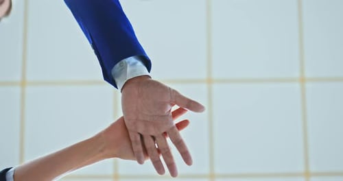 Teamwork and Team Building: Hands Stacking