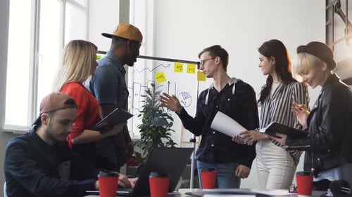 Team Meeting in Modern Office Discussing Data