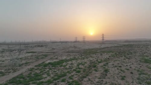 high-voltage power lines at sunset,high voltage electric transmission tower