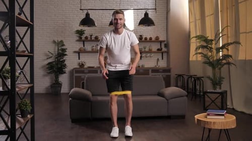 Man Exercising at Home with Resistance Band