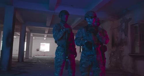 A Group of Professional Soldiers in Uniform with Military Equipment and a Rifle Leave the Building